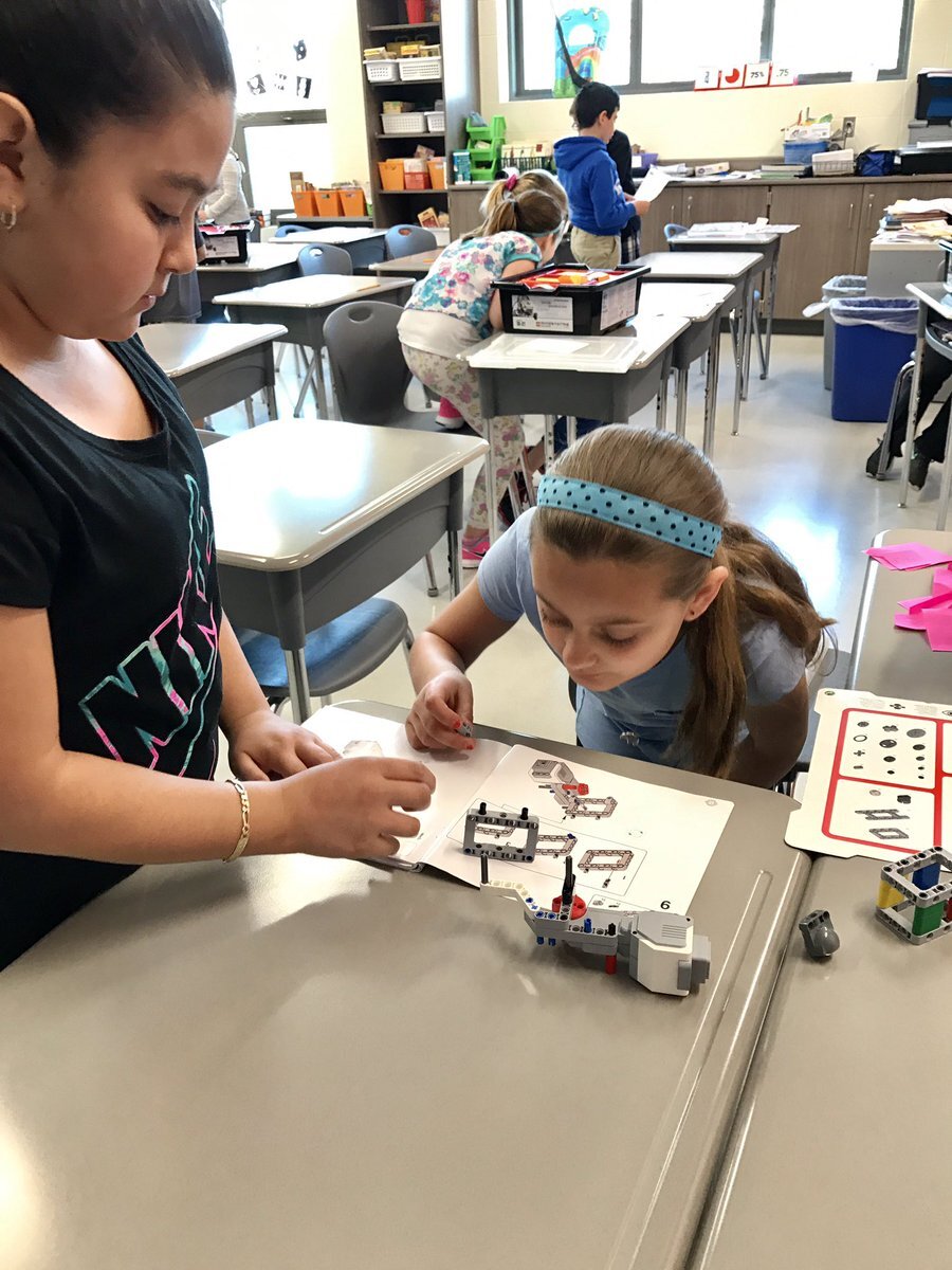 Students working with Lego Robotics at desks